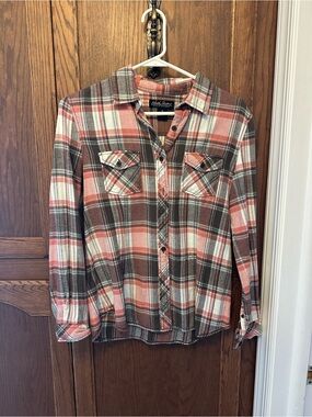 Grey and salmon color plaid shirt.